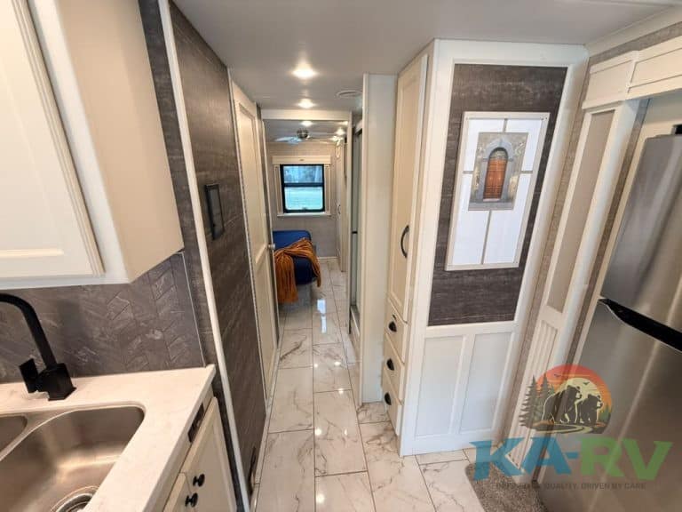 RV interior with kitchen, storage, and living area in Tiffin Allegro Bay 38AB.