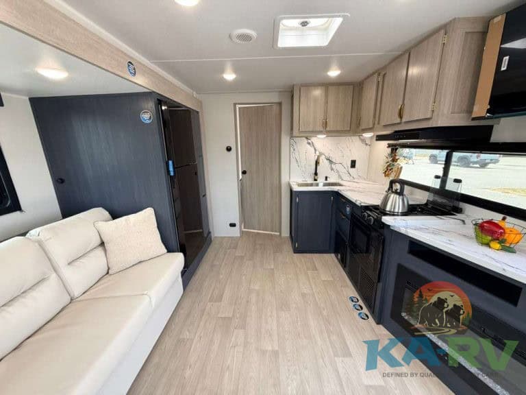Interior of 2026 Acclaim 2500RD RV with kitchen and seating area.