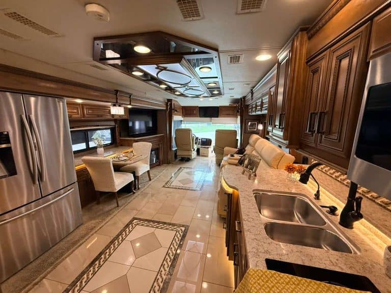 Luxury RV interior with kitchen, seating, and entertainment for 2016 Entegra Cornerstone 45B.