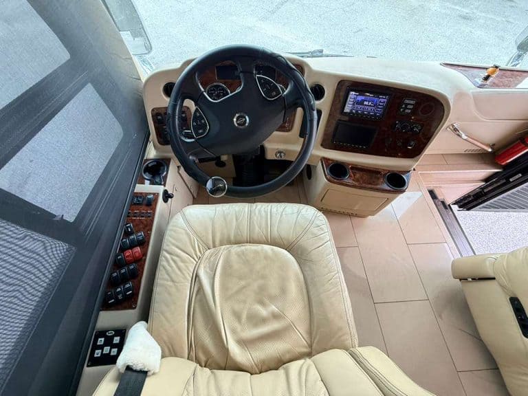 RV dashboard and driver seat in a 2016 Entegra Cornerstone 45B.