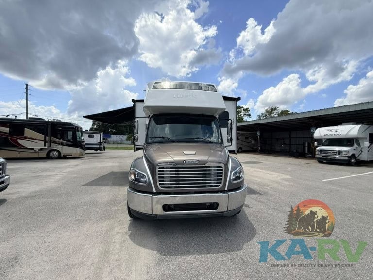 Front view of 2025 Tiffin Allegro Bay 38AB RV in dealership lot.
