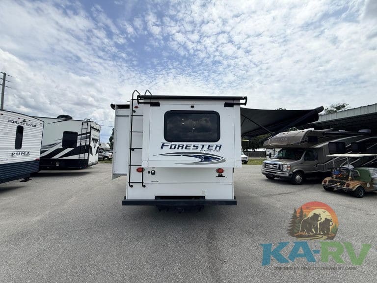 Forester 2501TS RV rear view with outdoor awning and storage compartments.
