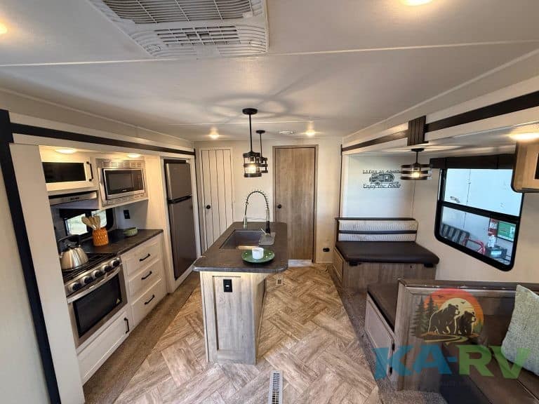 RV kitchen with appliances, seating, and modern interior at KA RV Repair.