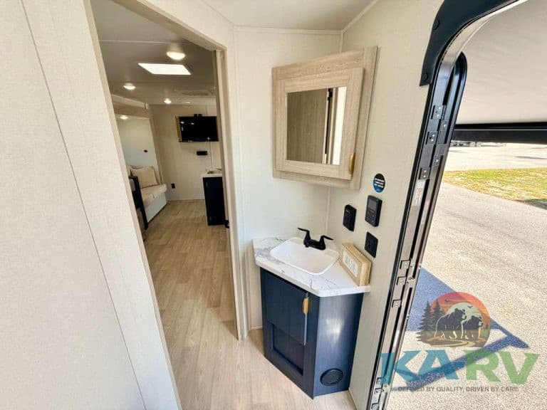 Interior view of the 2026 Acclaim 2700BH RV showing sink and mirror.