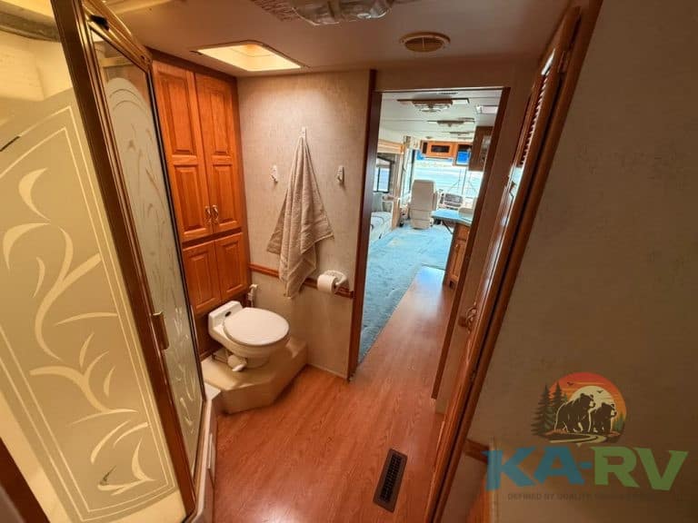 Luxury RV bathroom with toilet and shower area at KA RV Repair.