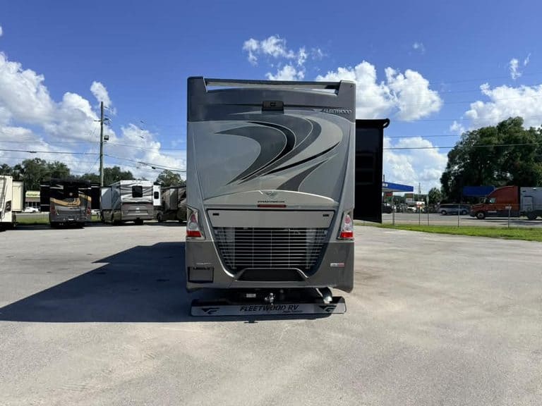 Front view of 2018 Fleetwood Discovery 40X LXE RV in dealership lot.