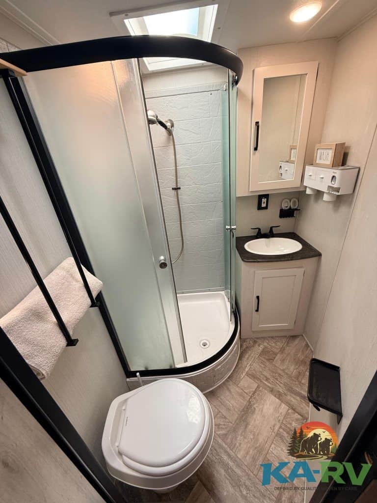 RV bathroom with shower and toilet for optimal space utilization.
