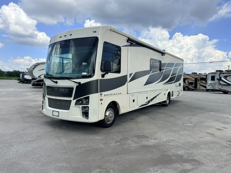 Modern 2023 Coachmen Mirada 35OS motorhome at RV dealership.