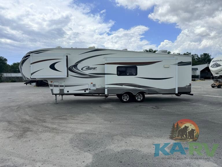 Travel trailer RV parked outdoors, ideal for Optima travel needs. Expert RV repair and maintenance s.