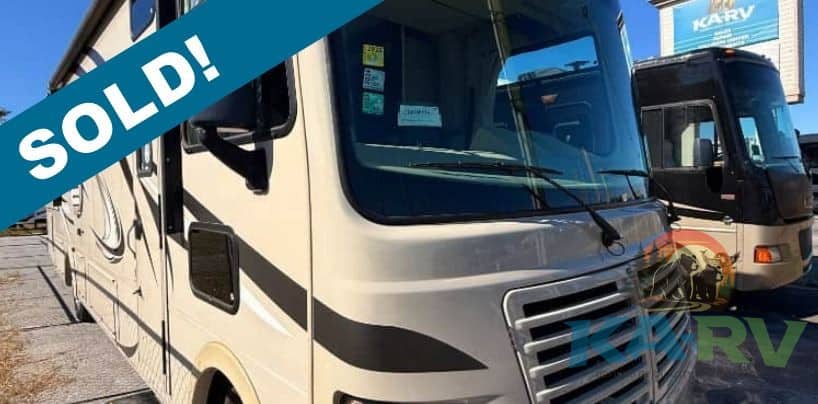 2014 Coachmen Pursuit 31BDP RV with sold banner.