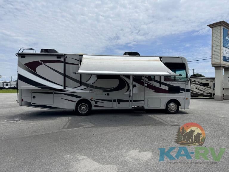 RV with awning extended at KA RV Repair dealership in Optima.