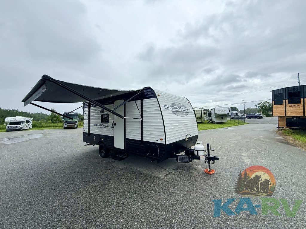 Keystone Springdale 1800BH travel trailer with awning extended.