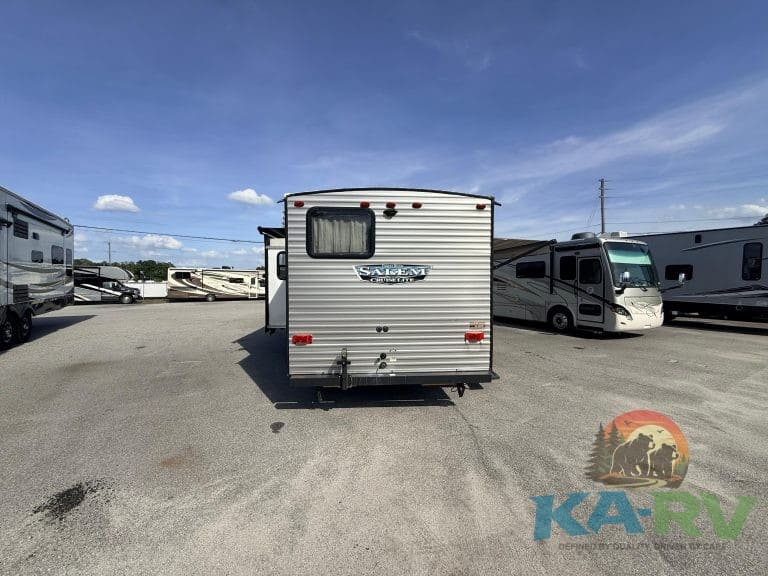 Rear view of a 2021 Forest River Salem Cruise Lite 263BHXL travel trailer in a dealership lot.