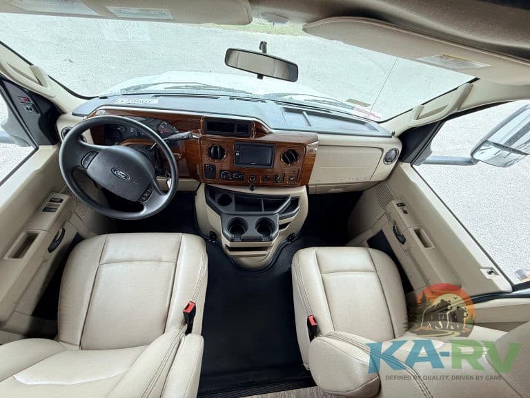 Interior view of a 2019 Forest River Forester RV dashboard and seating.