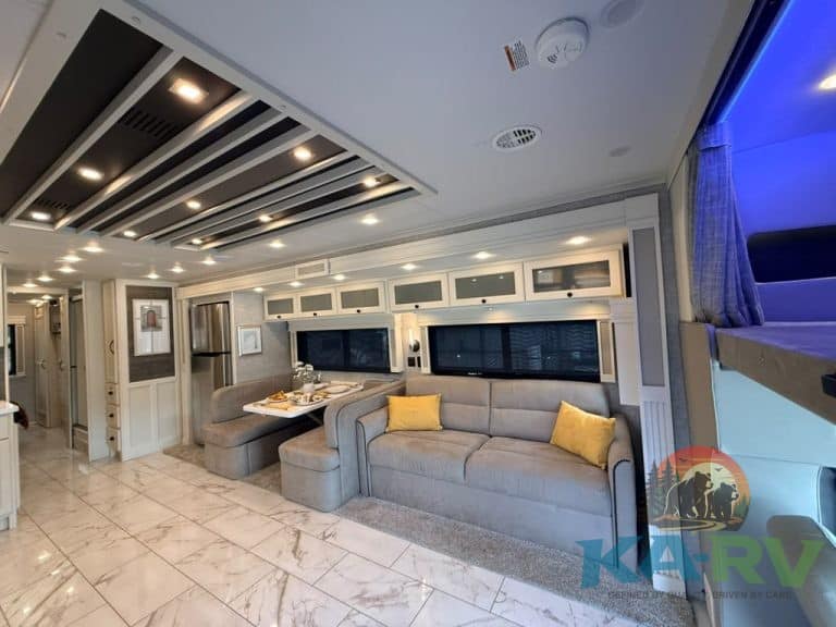 Spacious RV interior with modern design and comfortable seating.