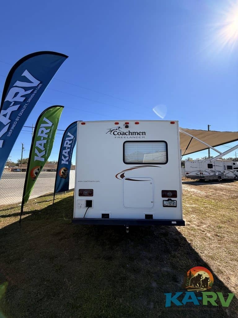 Rear view of 2013 Coachmen Freelander 23CB RV at Karv Repair lot.