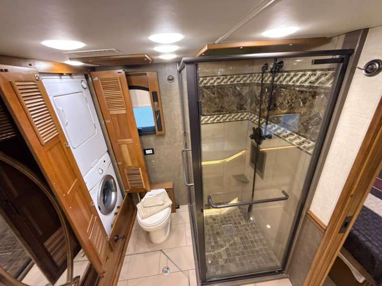 Bathroom in 2016 Entegra Cornerstone 45B RV with shower and toilet.