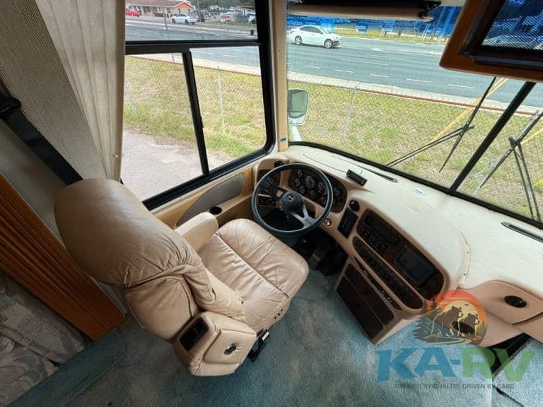 Interior view of RV driver's seat and dashboard at KA RV Repair.