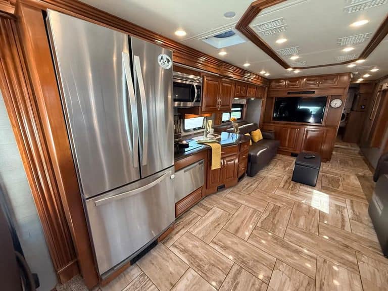 Luxury RV interior with kitchen and living area in a Fleetwood Discovery 40X LXE.
