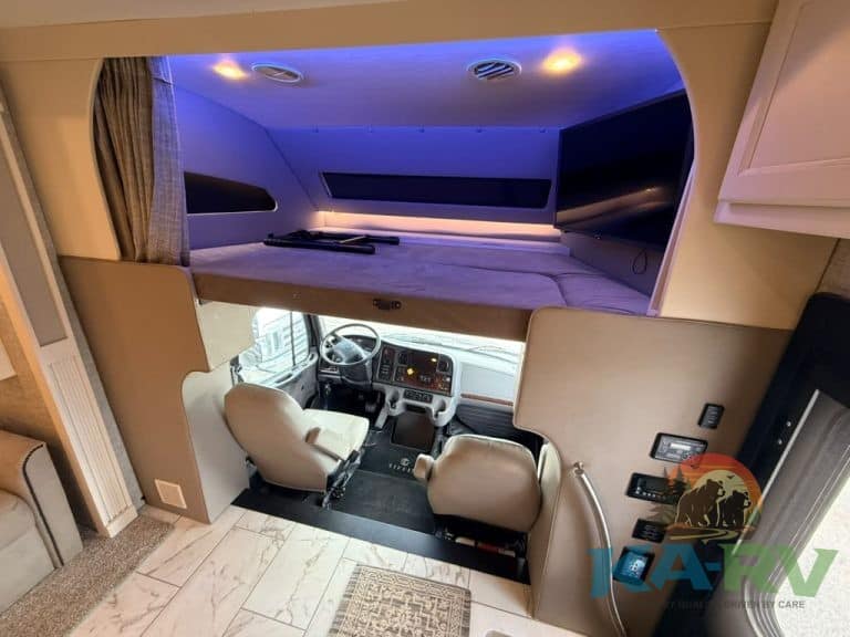 Luxury RV interior with sleeping area and cockpit view in Tiffin Allegro Bay 38AB.