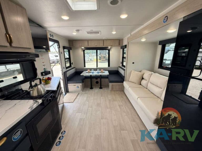 Spacious RV interior with kitchen and seating area for 2026 Acclaim 2500RD.