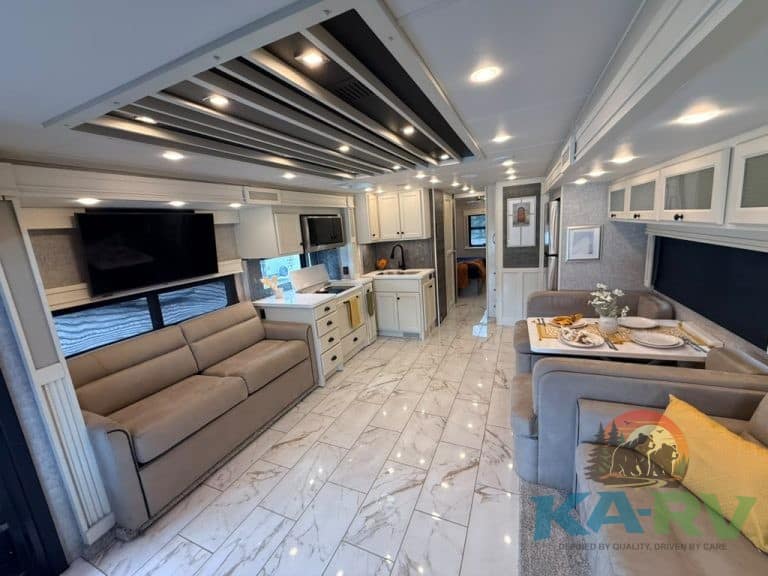 Spacious RV interior with modern kitchen and living area in Tiffin Allegro Bay 38AB.