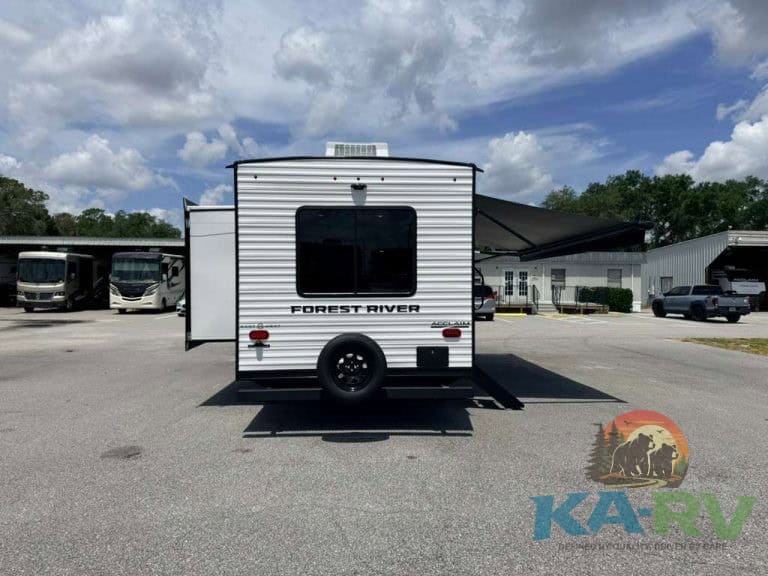 White Forest River RV with slide-out at Karv Repair service center.