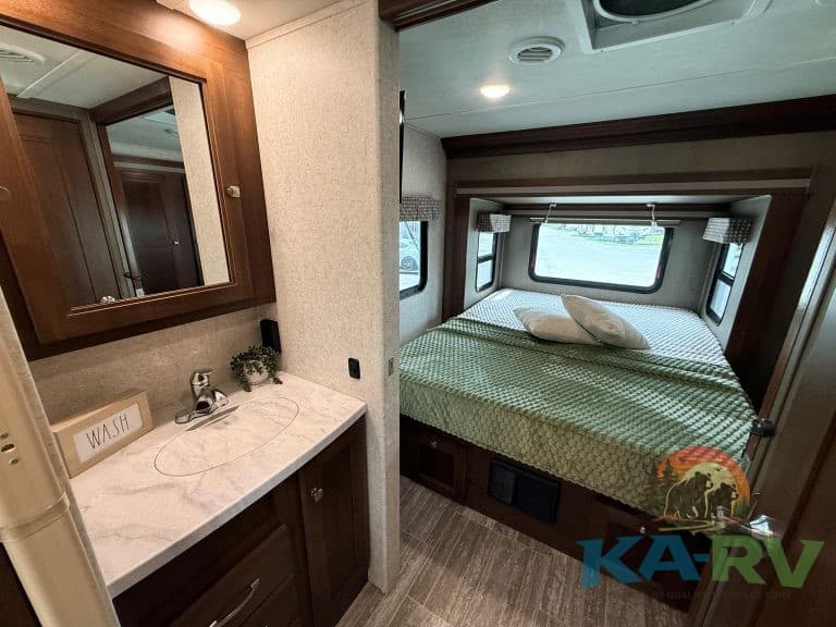Interior of a 2019 Forest River Forester 2501TS RV bedroom with bed and storage.