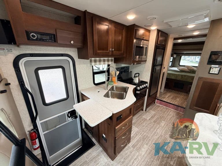 Interior view of a 2019 Forest River Forester 2501TS RV showing kitchen and living area.