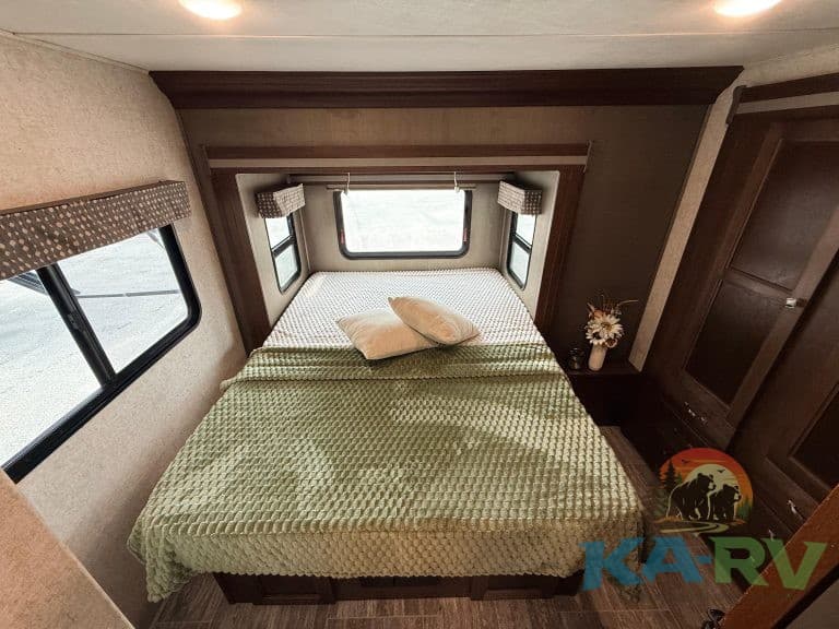 Interior view of a 2019 Forest River Forester 2501TS RV bedroom.