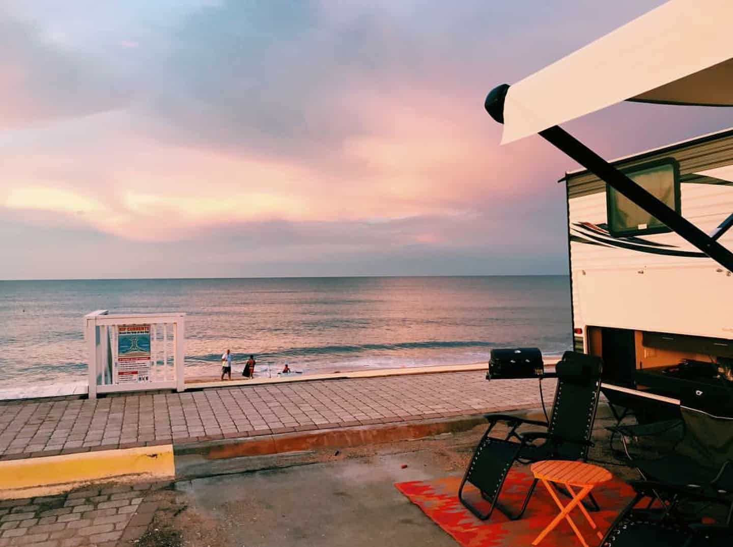 A sunset over an RV awning on the oceanfront at Beverly Beach RV Resort, one of the best Daytona Beach RV Parks.