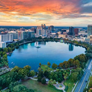 Orlando skyline with lake, parks, and cityscape at sunset, ideal for RV travelers near top RV parks.