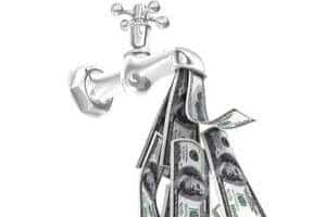 Tools and money indicating plumbing leak detection and repair costs.