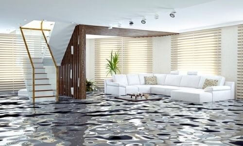 Contemporary living room with white sofa, wooden staircase, and patterned floor.