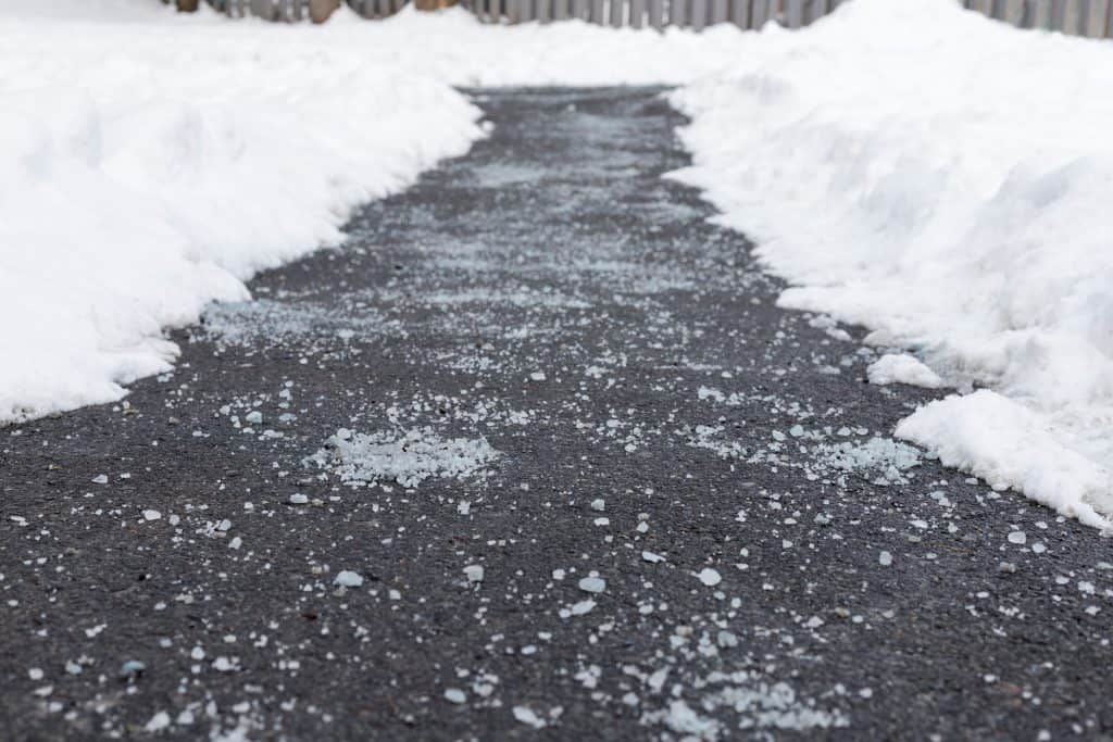 Winter road with salt for melting snow