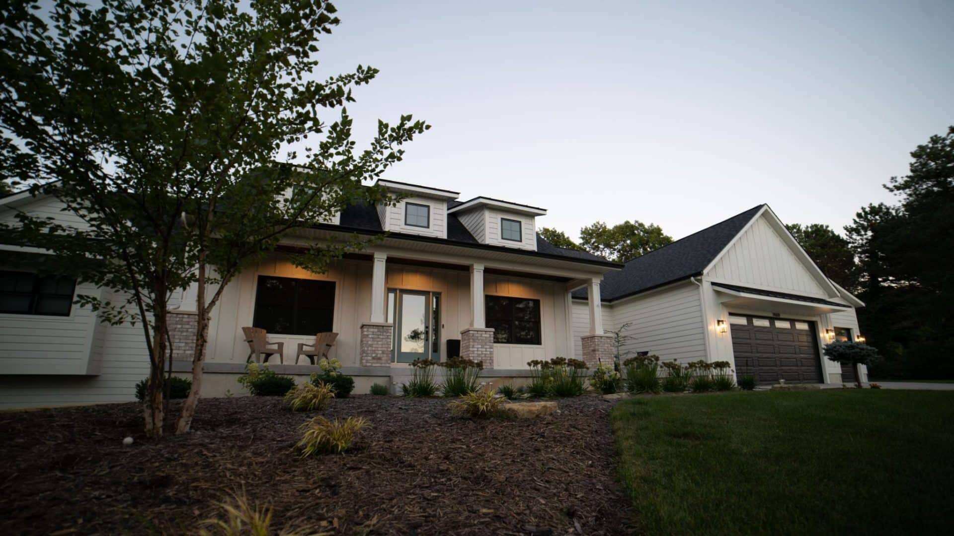 Beautiful modern suburban house with landscaped yard and attached garage.