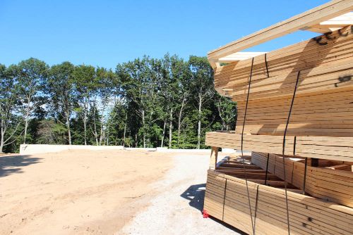 New home construction site with lumber ready for building.