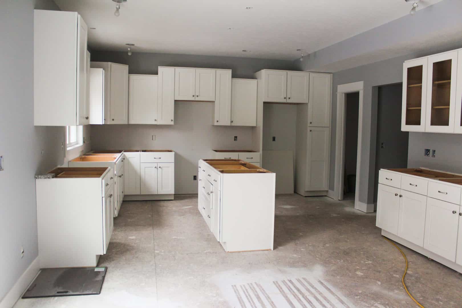 New kitchen cabinets and countertops installation in a residential home.
