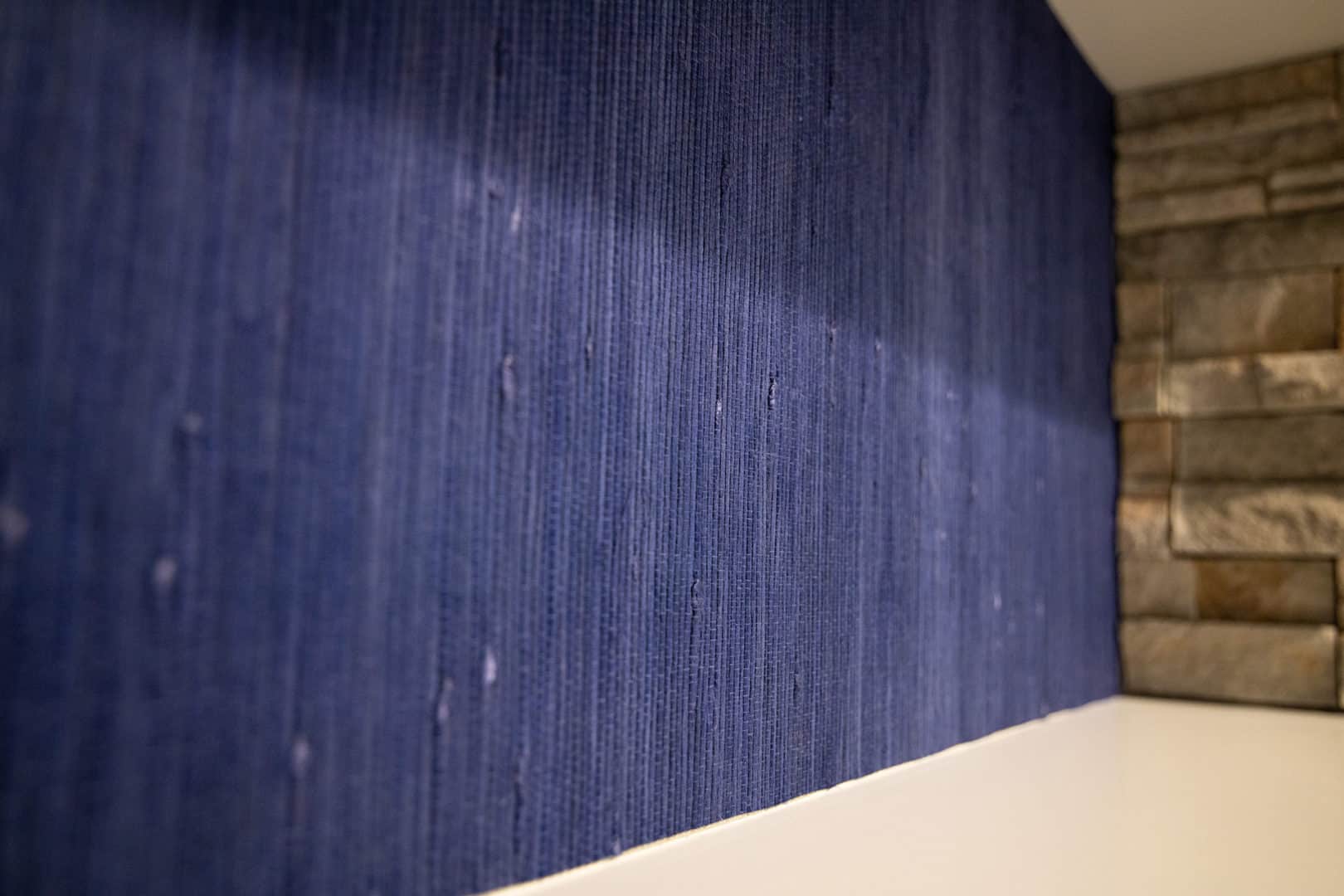 Interior blue textured wall in Livingston Homes model.