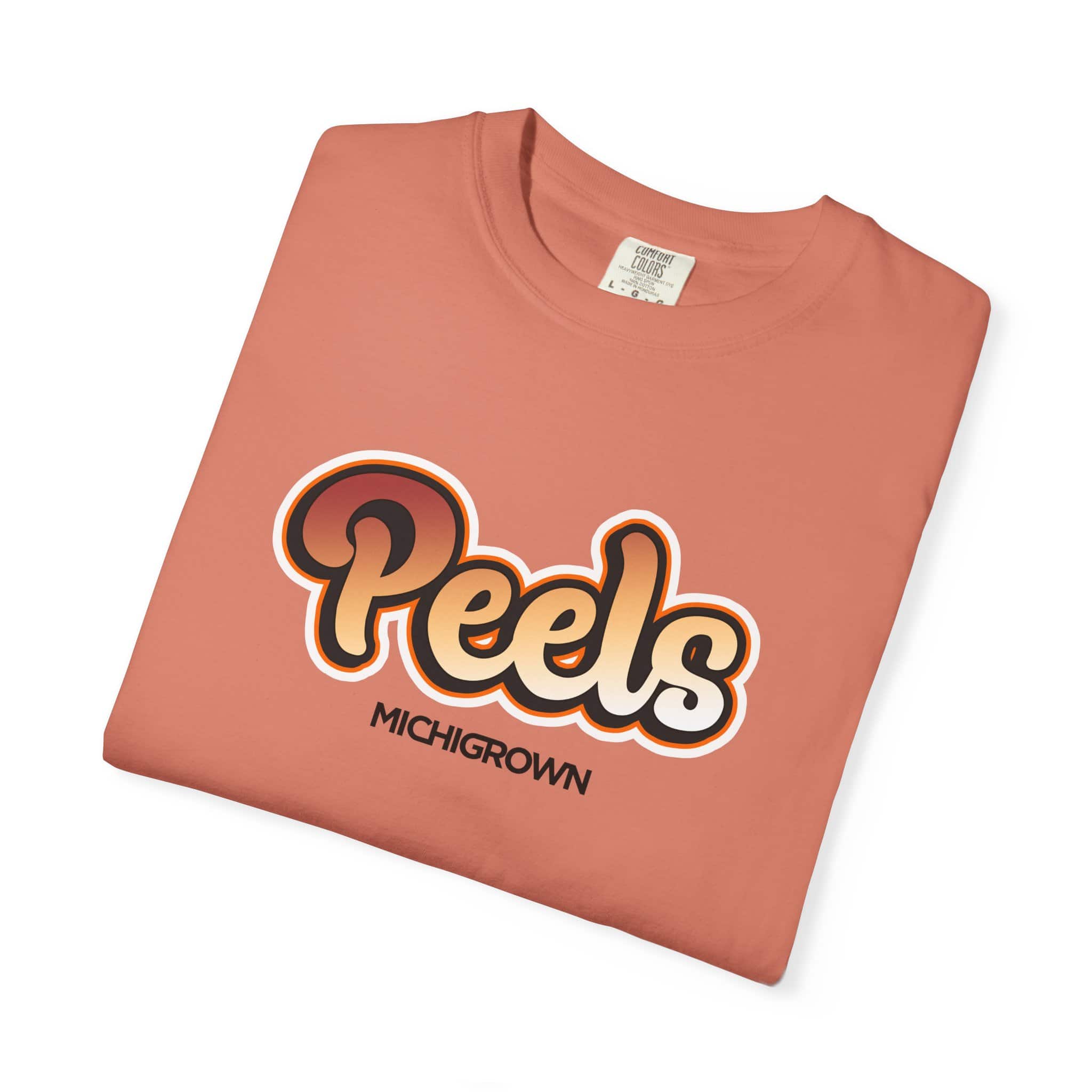Peels Michigan T-shirt with logo on peach-colored fabric.