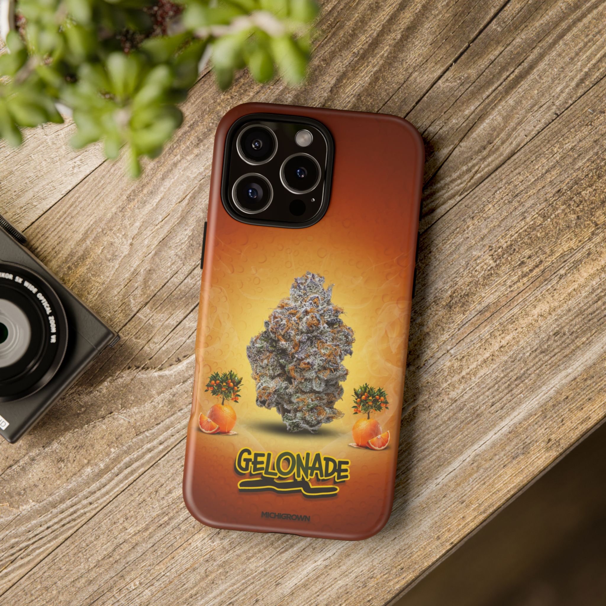 Phone case with Gelonade cannabis strain design on wooden surface.
