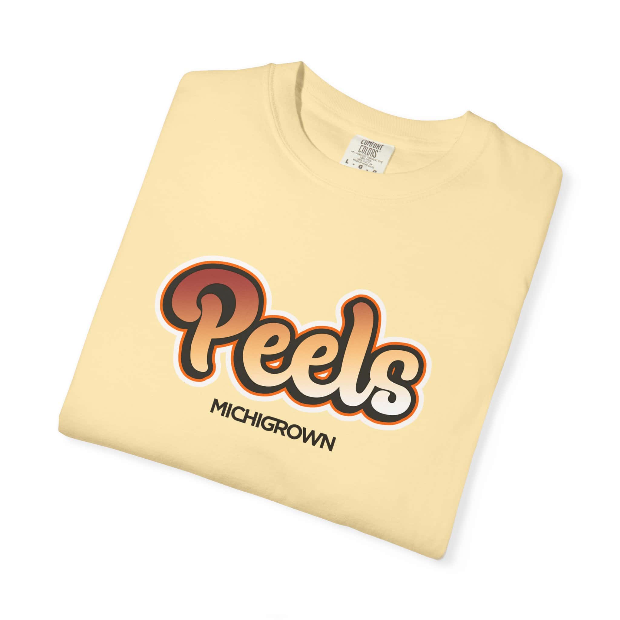 Cream-colored T-shirt with 'Peels' and 'Michigrown' logo design.