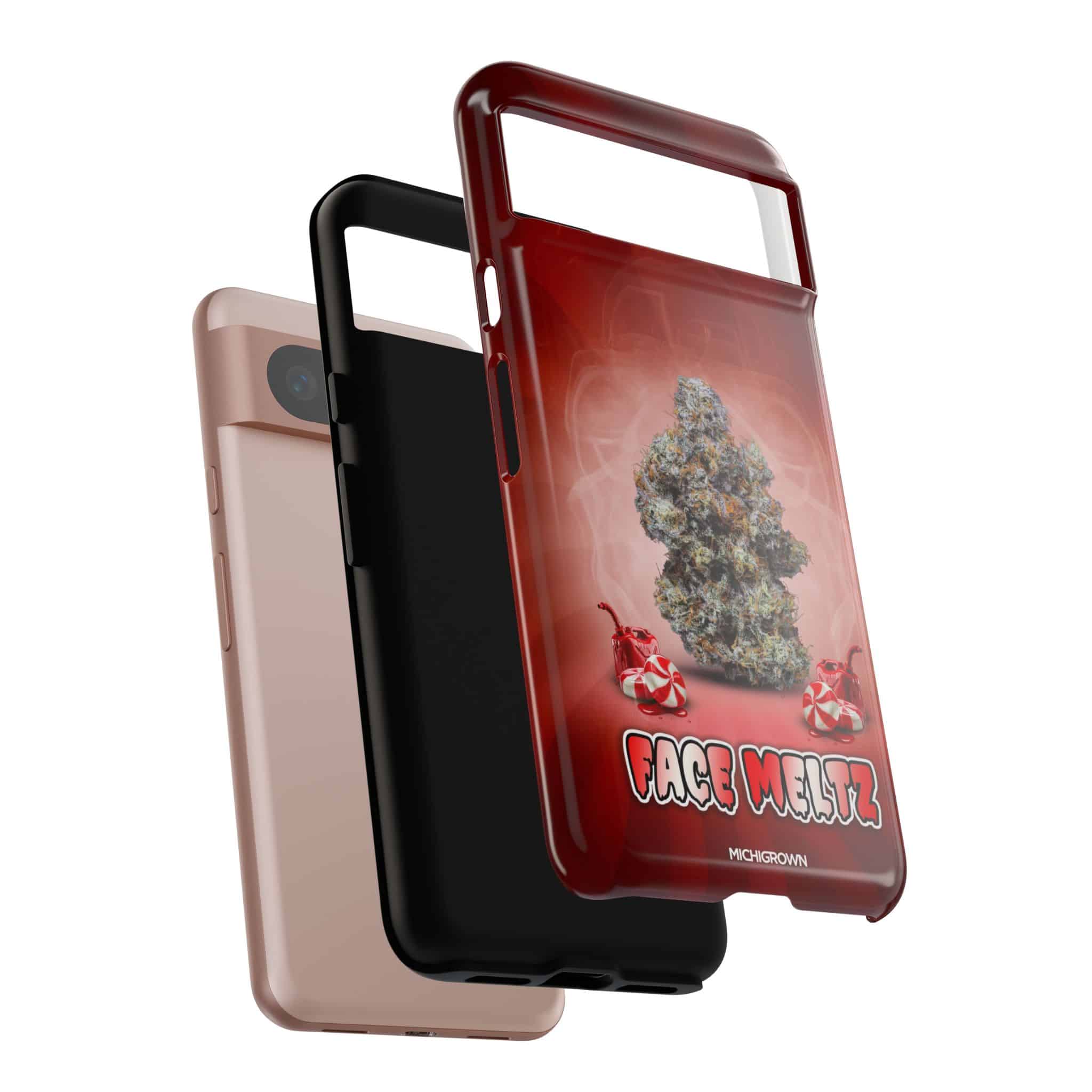 Three phone cases with FACE MELTZ design, one red, one black, one pink.