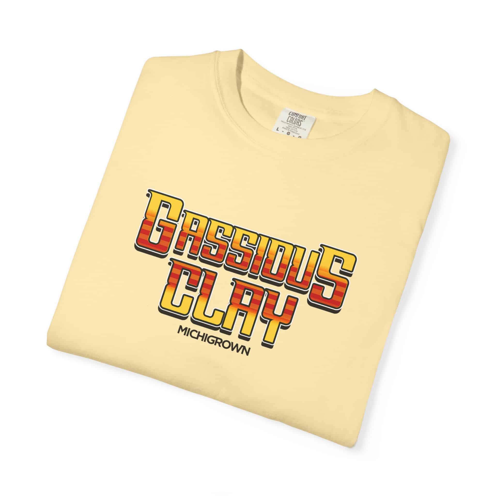 Cream-colored T-shirt with Gassious Clay design and text.