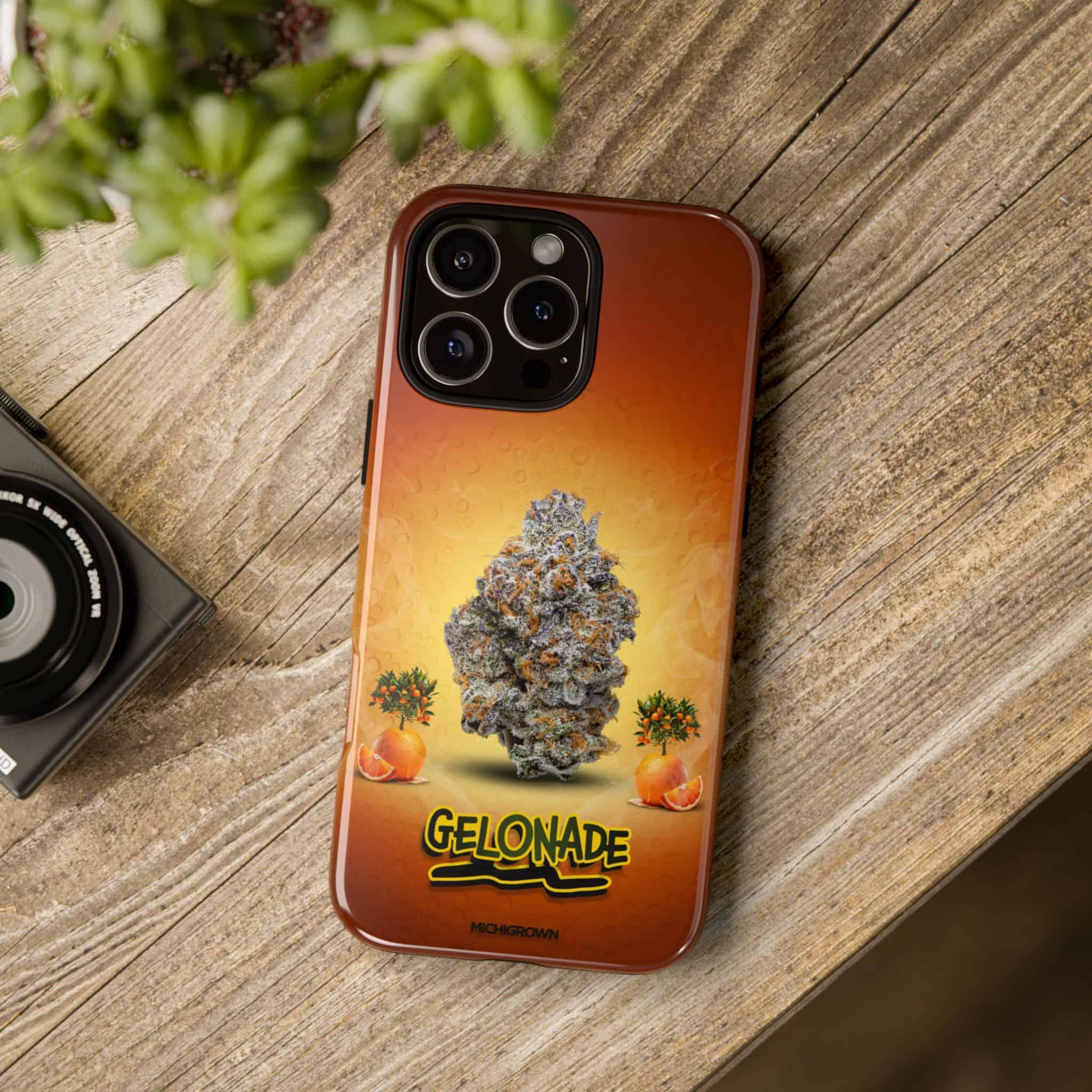 Phone case with Gelonade cannabis strain design on a wooden surface.