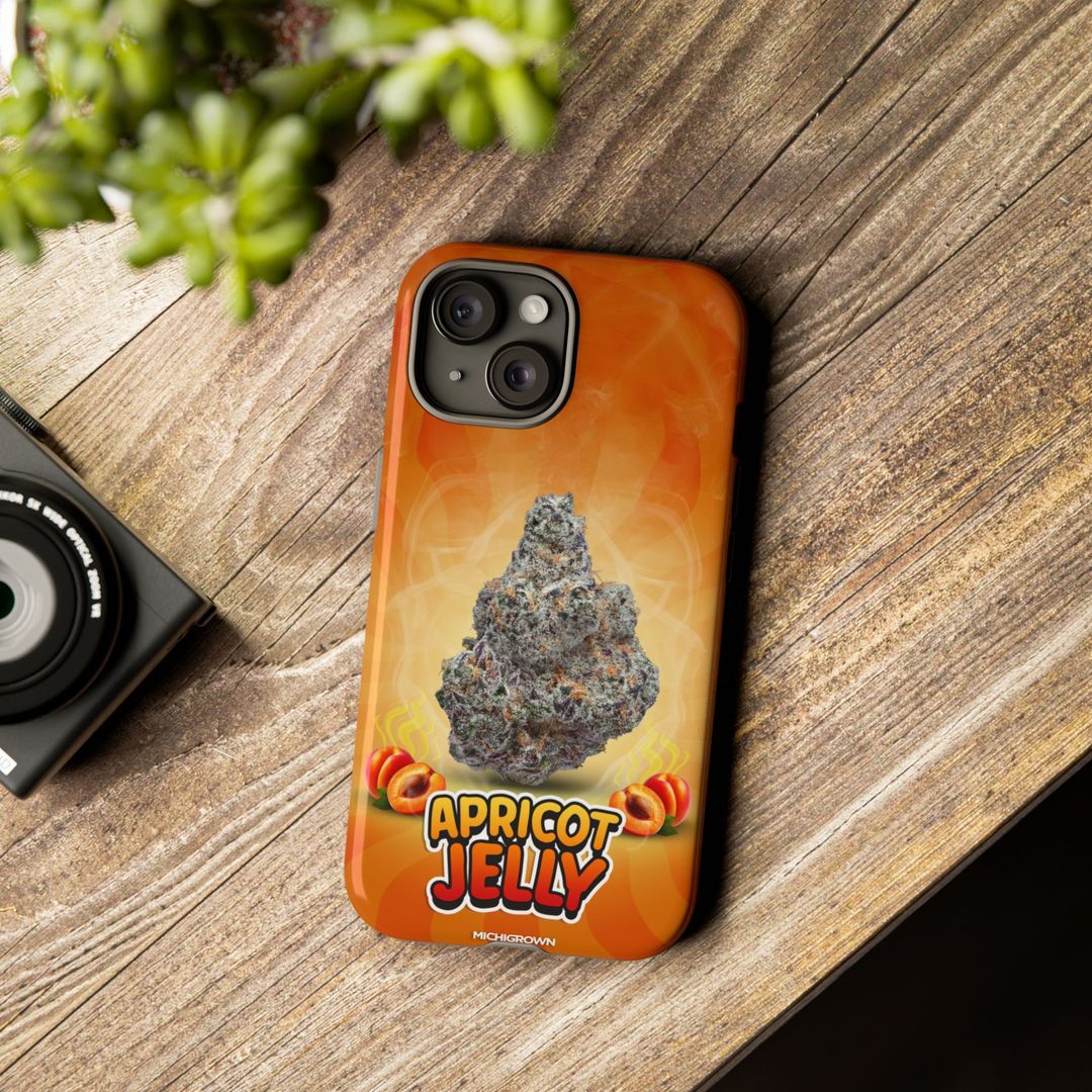 Phone case with apricot jelly design on a wooden surface.