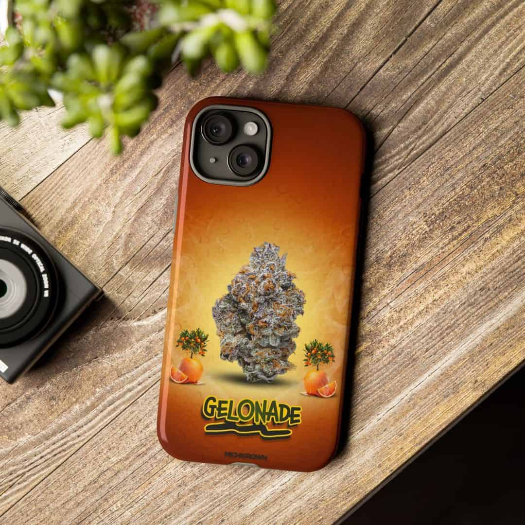 Phone case with Gelonade cannabis strain design on wooden surface.