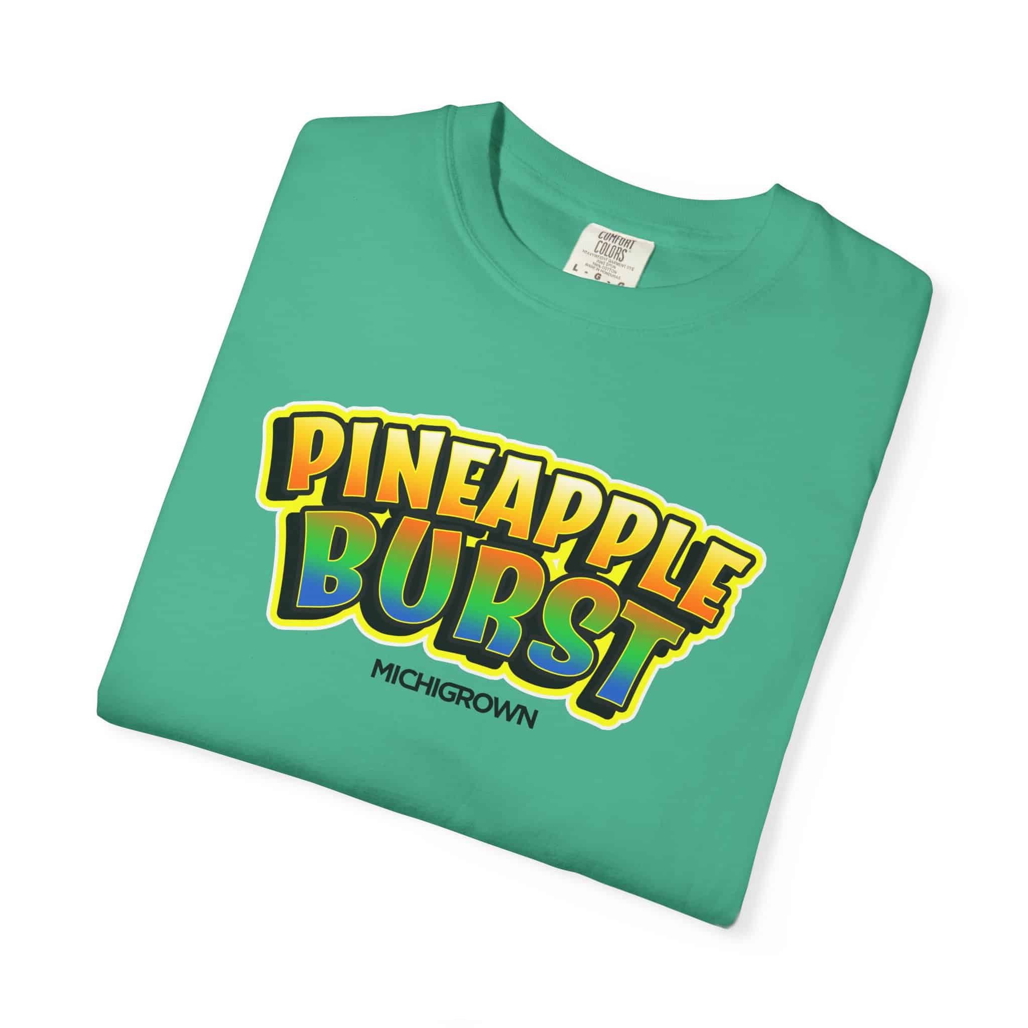 Green T-shirt with Pineapple Burst logo and Michigrown branding.