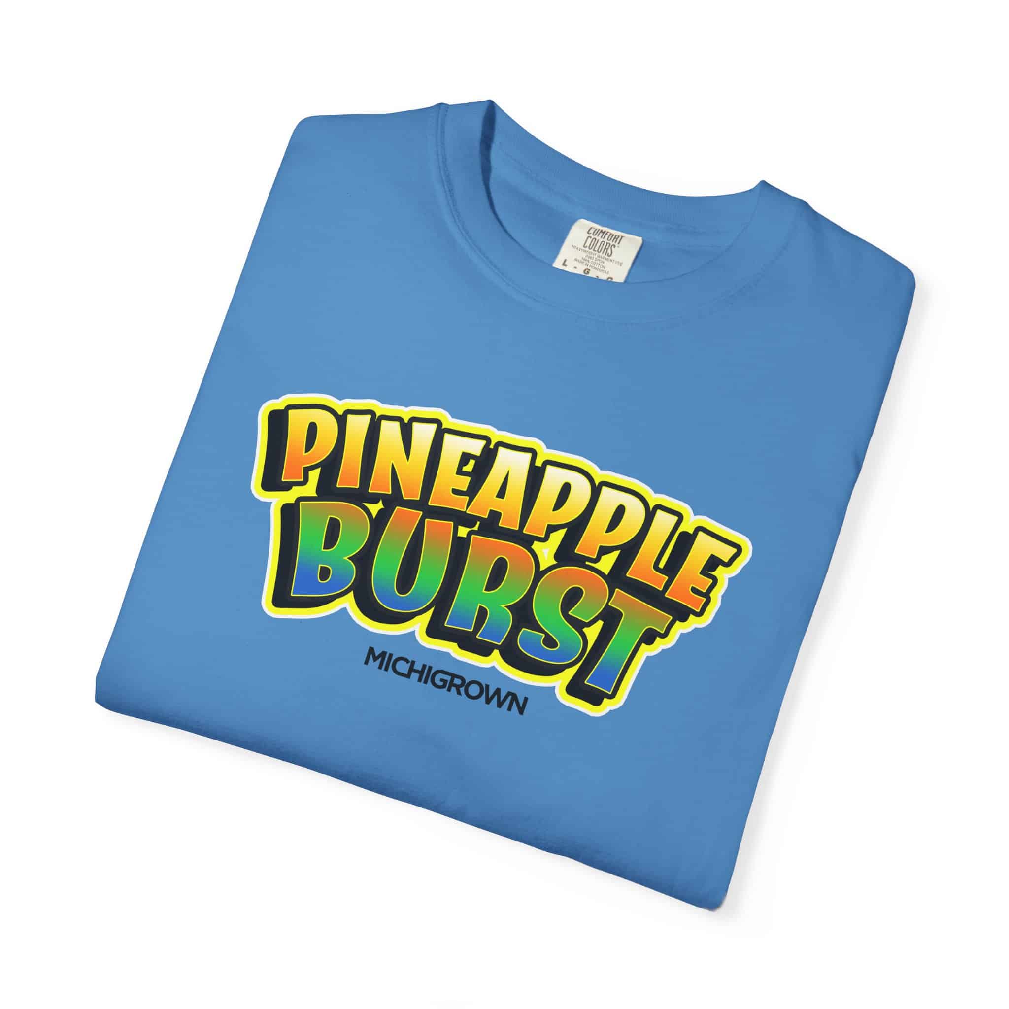 Blue T-shirt with Pineapple Burst logo and Michigrown branding.