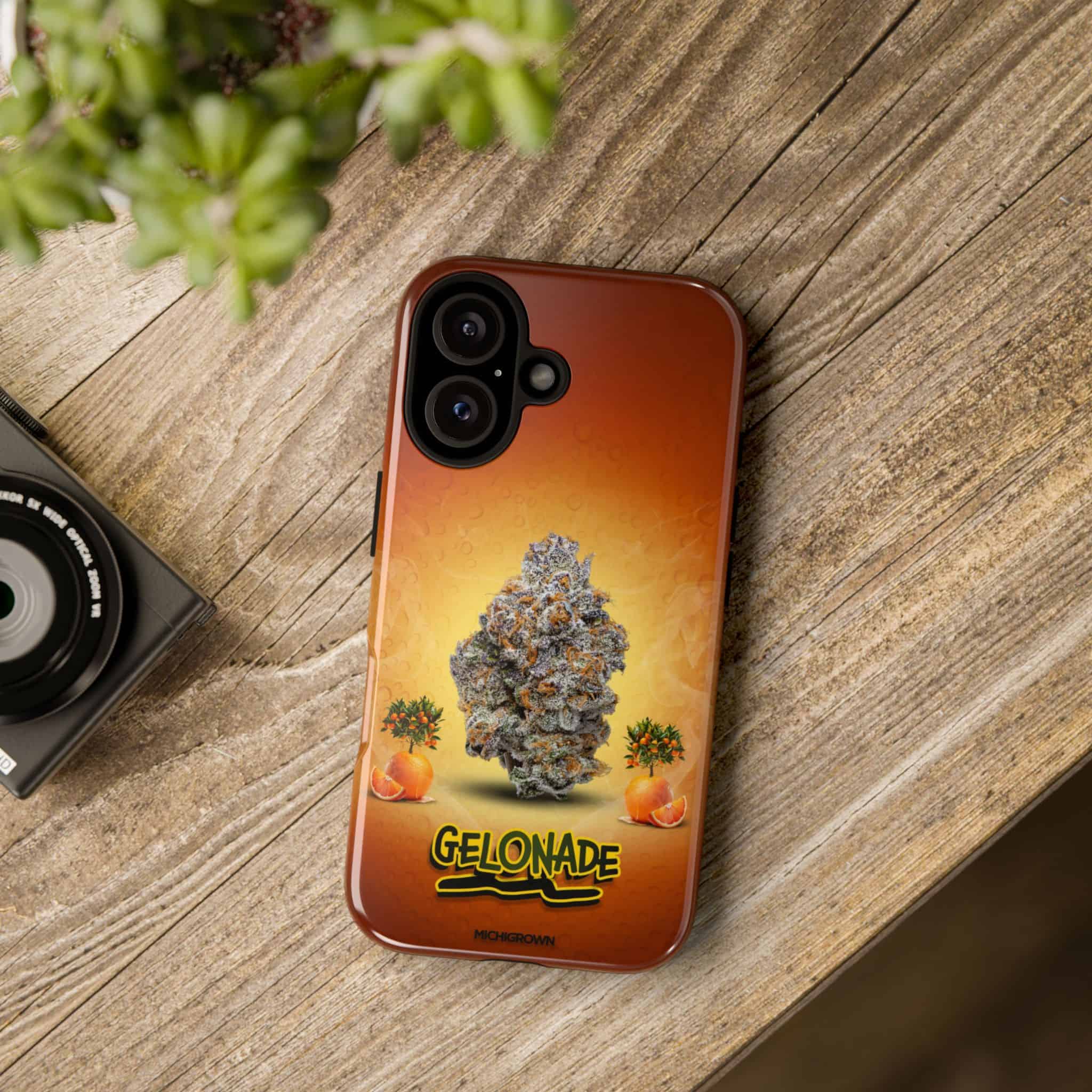 Phone case with Gelonade cannabis strain design on wooden surface.
